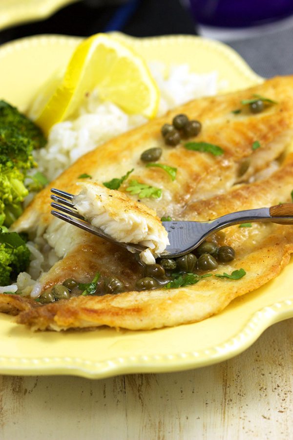 Ready in 10 minutes, this Easy Tilapia Piccata from RecipeGirl.com is a family weeknight favorite dinner recipe.