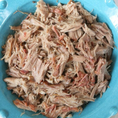 pulled kalua pork in a blue bowl