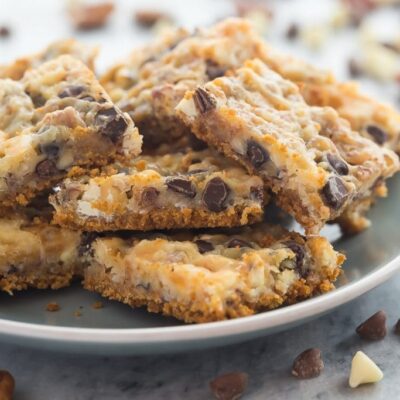 These Seven Layer Bars have a graham cracker crust and are piled with nuts, coconut, chocolate chips and white chocolate chips! They are totally decadent!