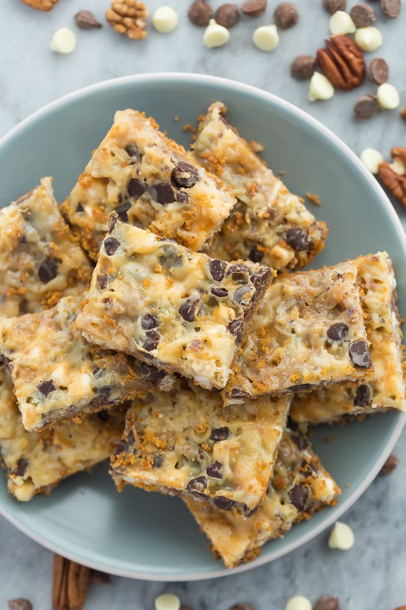 These Seven Layer Bars have a graham cracker crust and are piled with nuts, coconut, chocolate chips and white chocolate chips. Recipe from RecipeGirl.com.