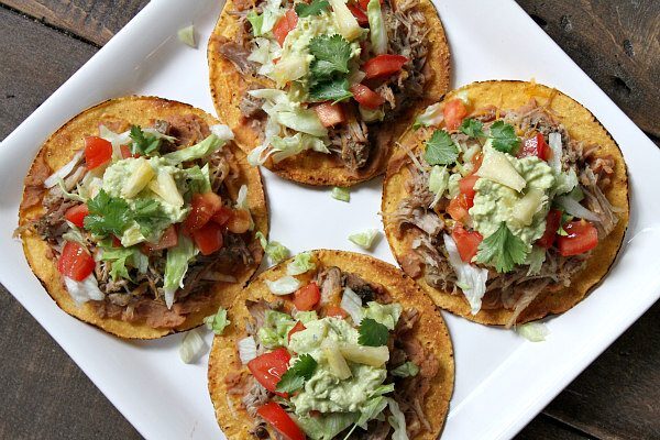 Carnitas Tostadas with Pineapple Guacamole - recipe from RecipeGirl.com