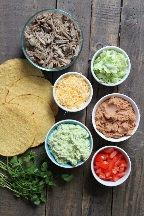 Carnitas Tostadas with Pineapple Guacamole - recipe from RecipeGirl.com