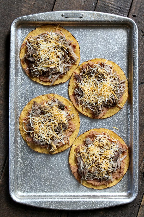 Carnitas Tostadas with Pineapple Guacamole - recipe from RecipeGirl.com