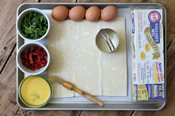 Ingredients displayed on a baking sheet for making Italian Egg Pastries