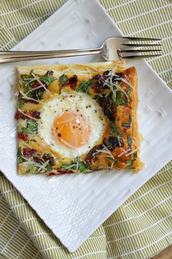 Baked Italian Egg Pastry on a white plate with fork