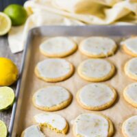 iced lemon lime cookies on a baking sheet