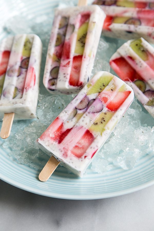 Breakfast Popsicles displayed on a plate of ice
