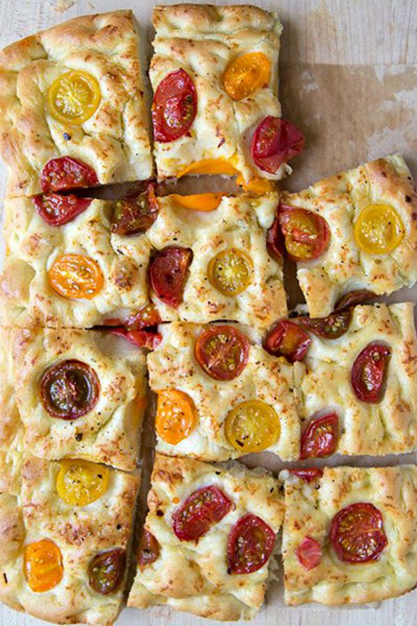 Tomato Focaccia Bread cut into slices with one slice missing