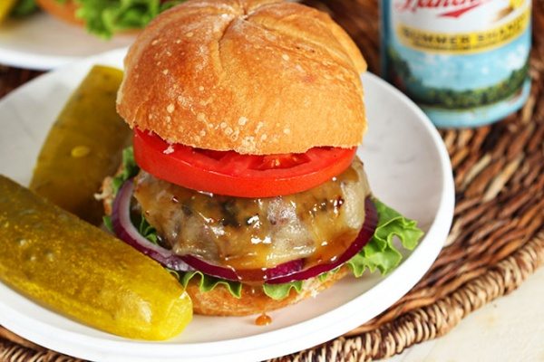Maple Bourbon Burger with Bacon Mustard Sauce recipe from RecipeGirl.com Maple Bourbon Burger on plate with pickles