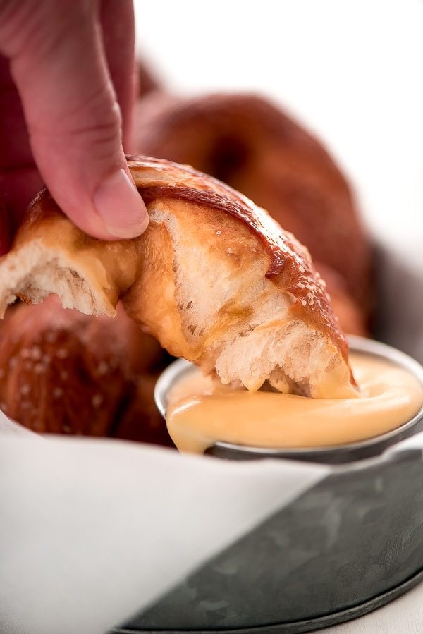 dipping a Soft Pretzel in sauce