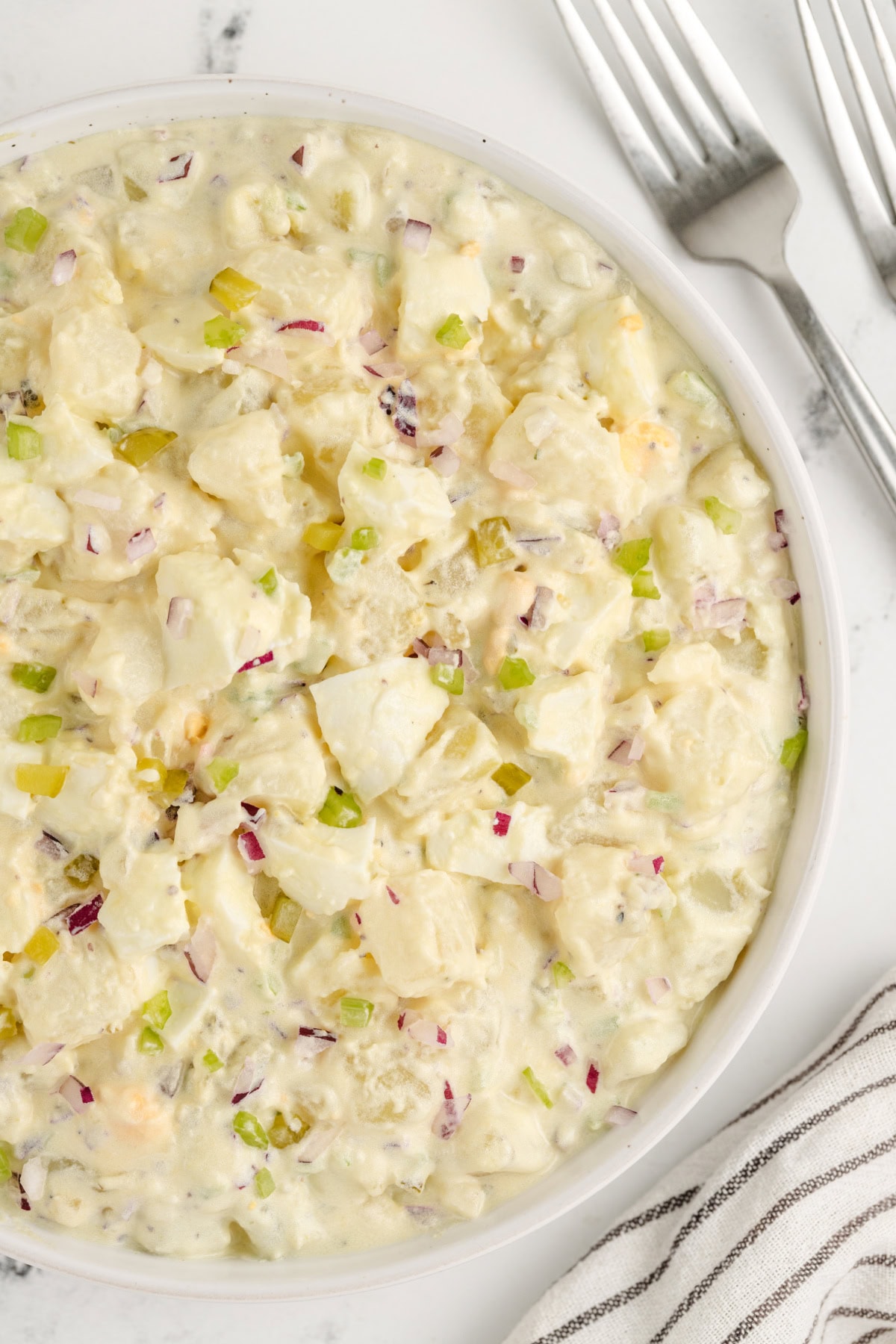 The perfect potato salad for every barbecue! American Potato Salad recipe from RecipeGirl.com american potato salad in bowl