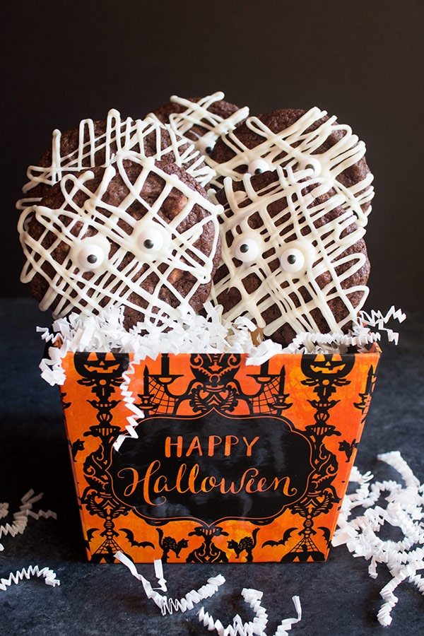 Mummy Cookie Pops in a Halloween container