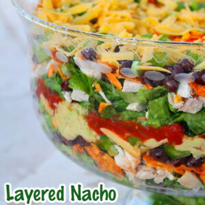 pinterest image for layered nacho salad