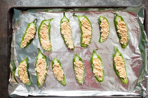 Pimento Jalapeno Poppers on a foil lined sheet pan
