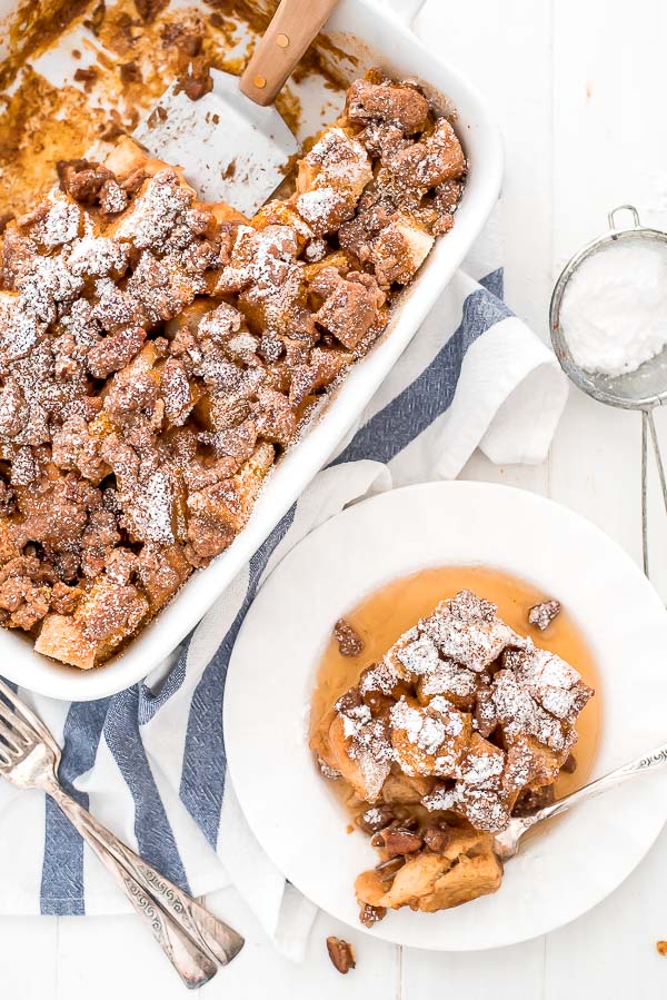 Pumpkin French Toast Casserole in a baking dish and one serving on plate