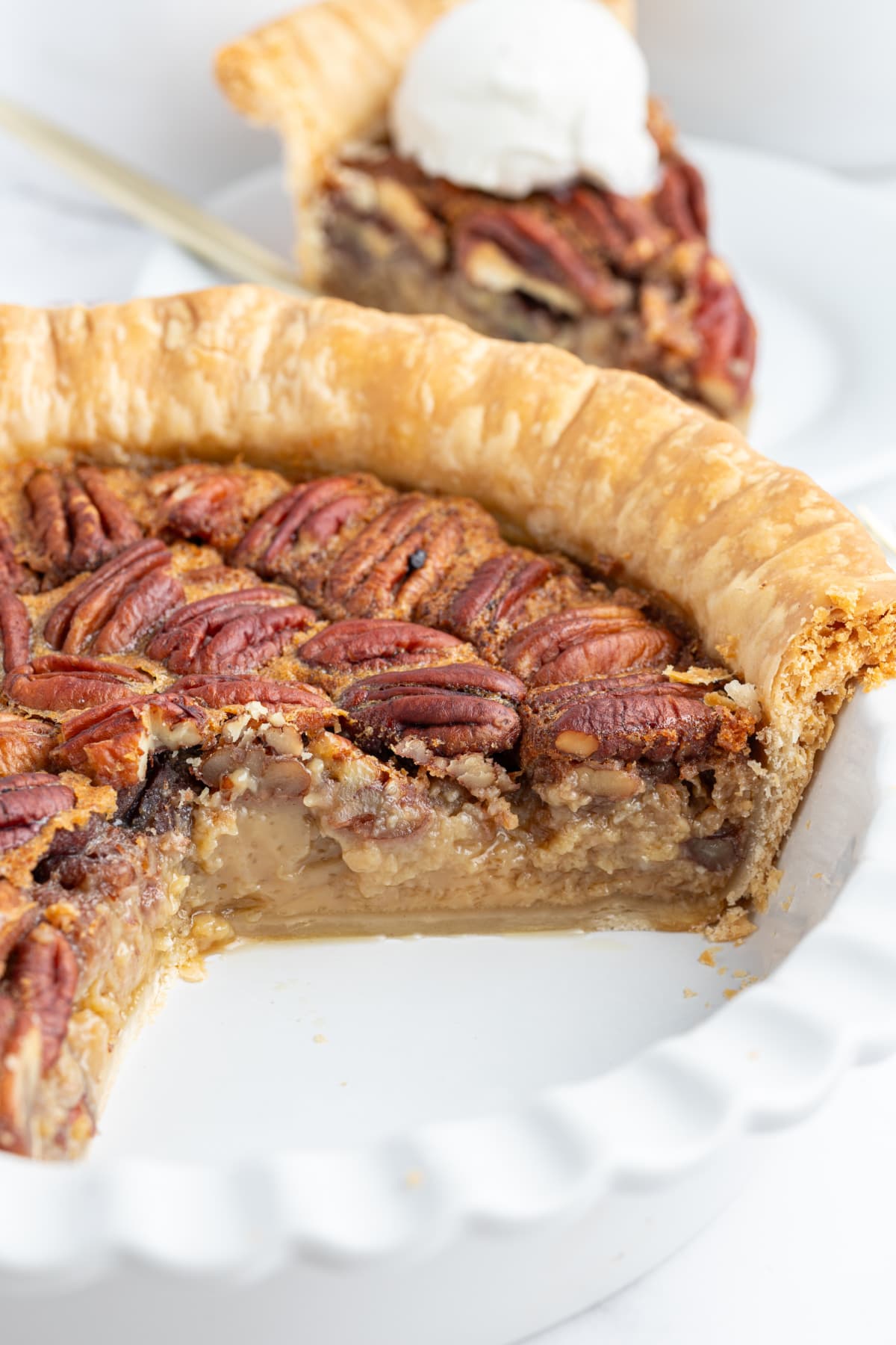 pecan pie with large slice taken out of it