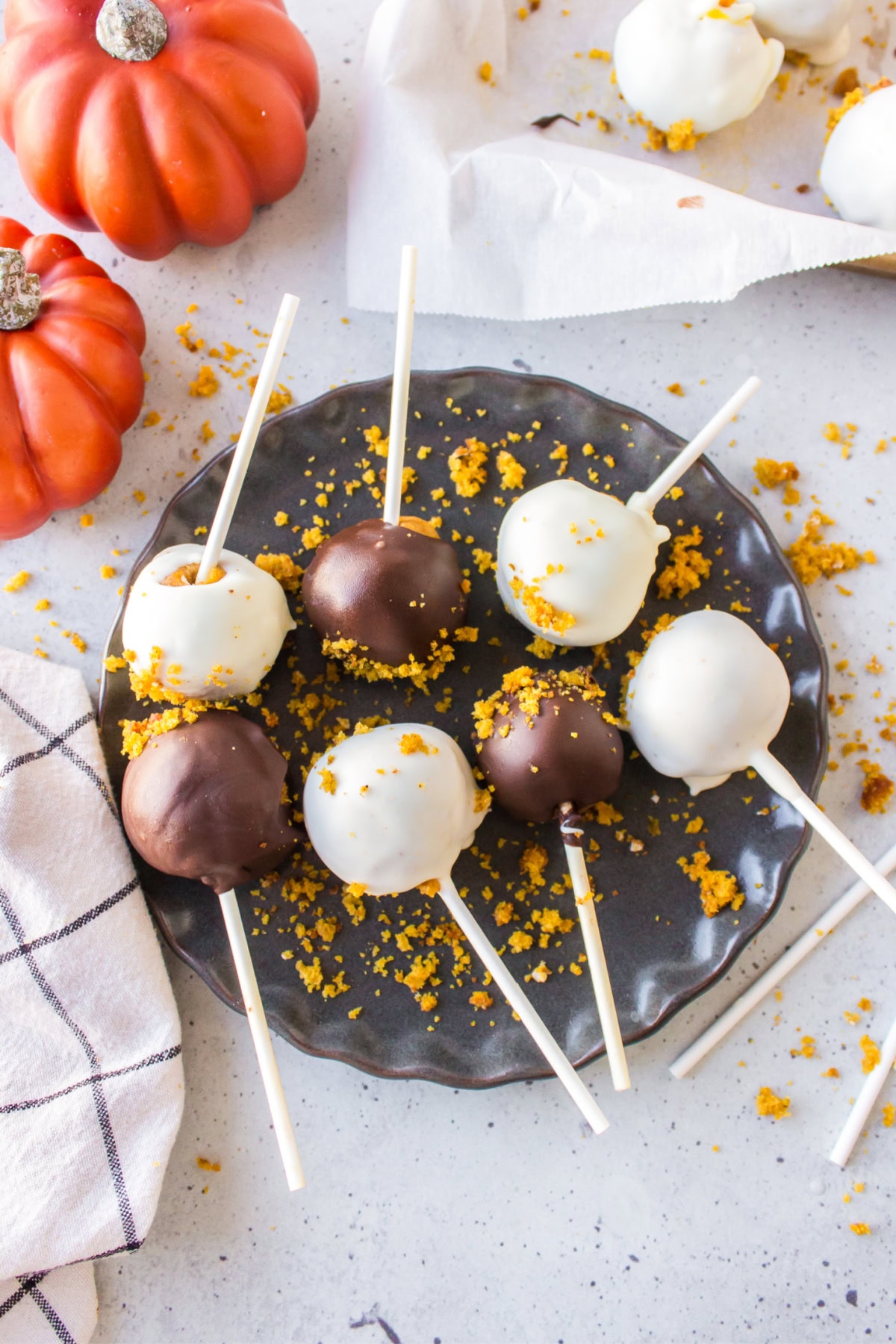 pumpkin cake pops on a plate