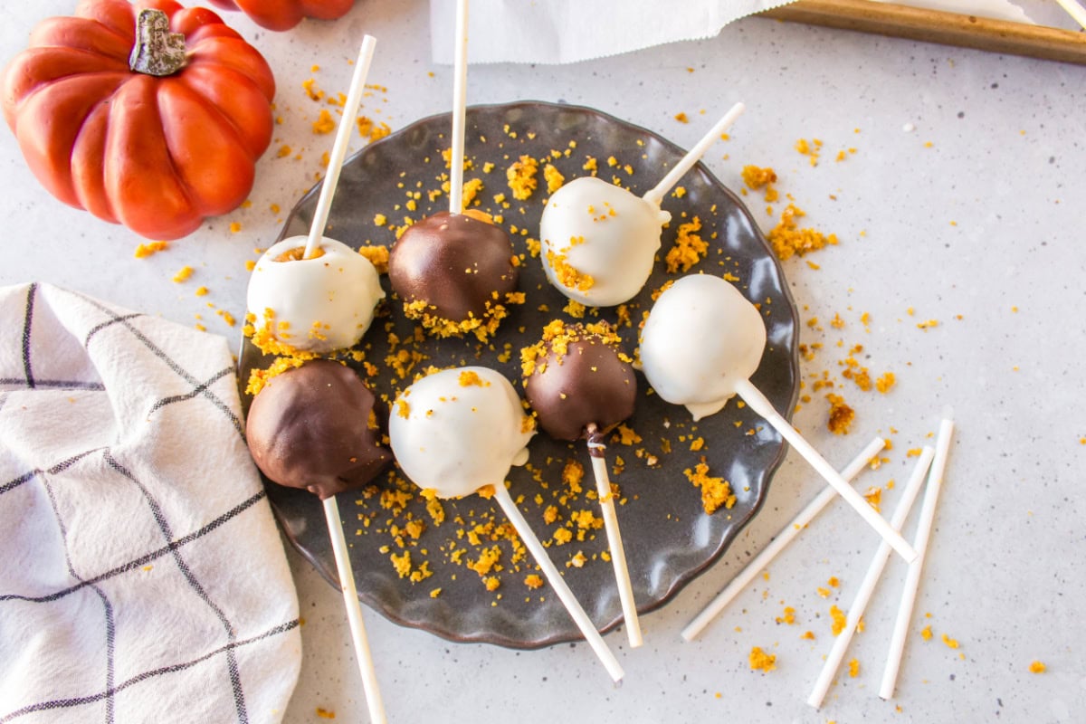 lots of white chocolate and regular chocolate covered pumpkin cake pops