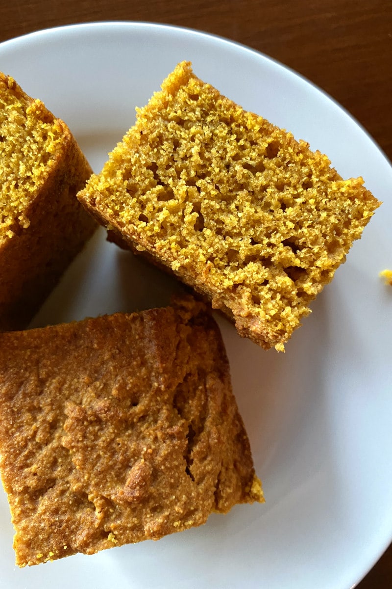 pumpkin cornbread on a white plate