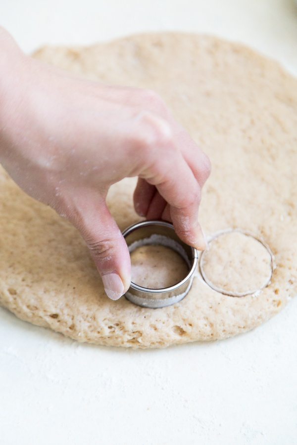 Cutting doughnut holes out of rolled out dough