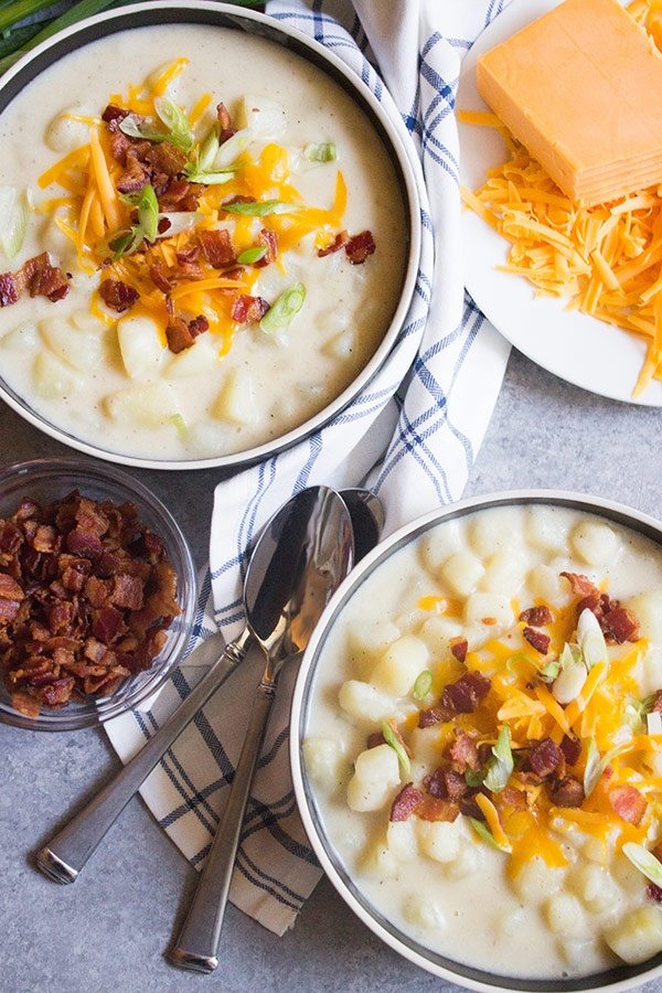 two bowls of Loaded Potato Soup with toppings