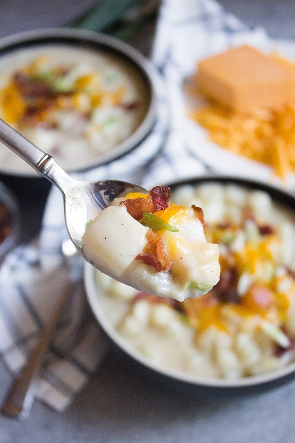 close up of Loaded Potato Soup on a spoon