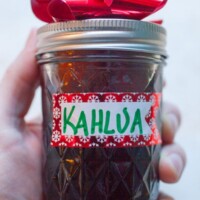 homemade kahlua in a jar with a red bow