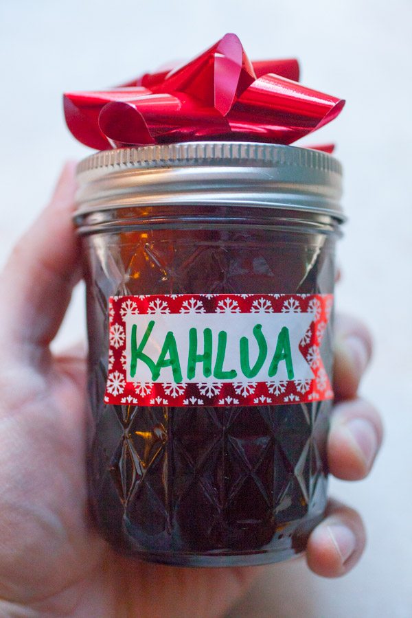 Homemade Kahlua in a jar with a red bow