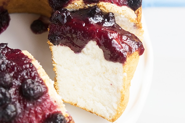 slice of easy angel food cake with blueberry topping