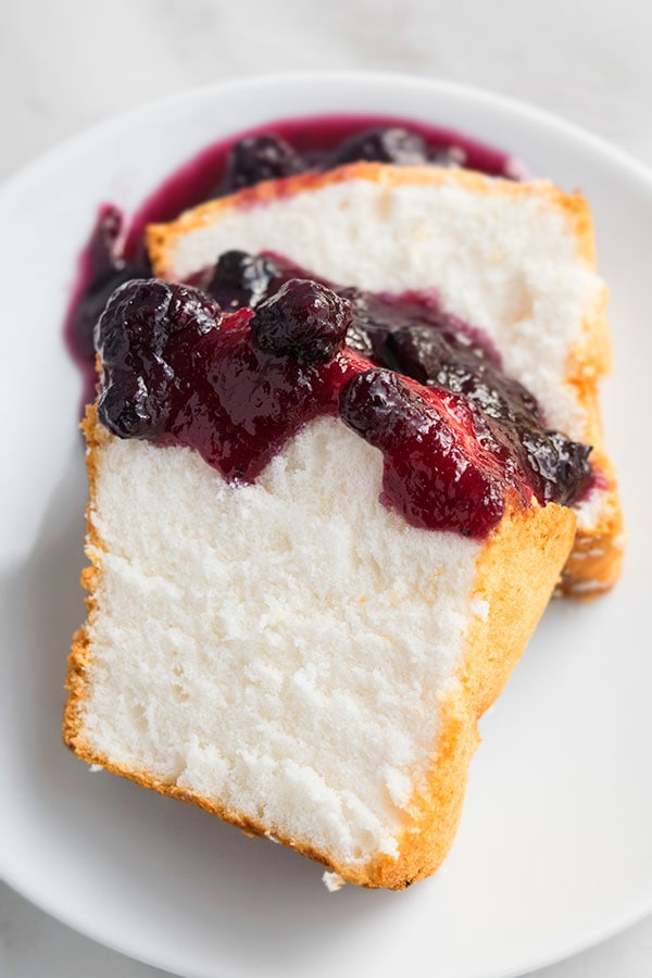 slice of easy angel food cake with blueberries