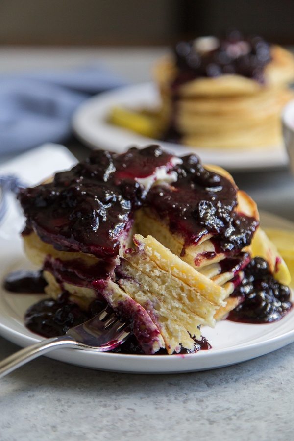 Forkful of Lemon Pancakes with Blueberry Sauce