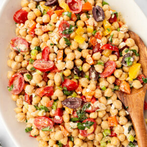 mediterranean chickpea salad in bowl with spoon