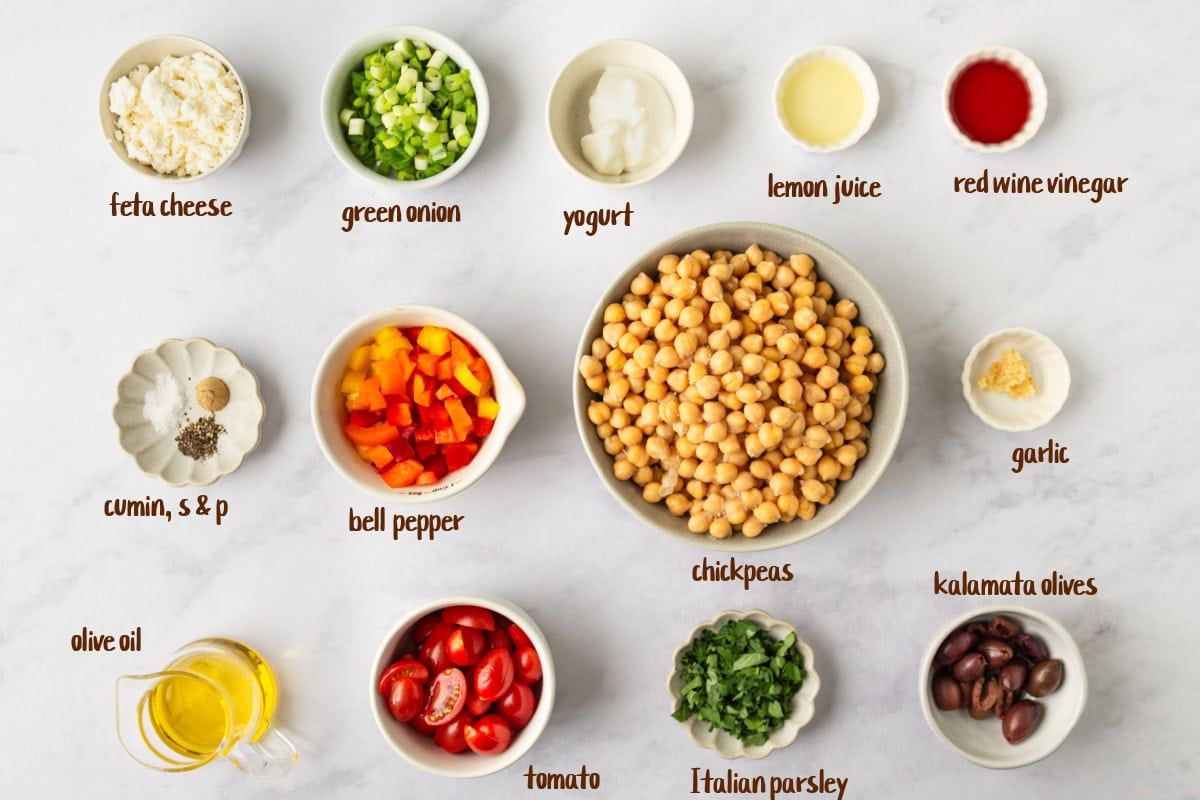 This Mediterranean Chickpea Salad is a super popular, delicious and easy salad recipe from RecipeGirl.com. ingredients displayed for making mediterranean chickpea salad