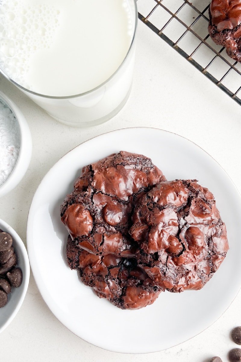 plate of three ooey gooey flourless chocolate cookies