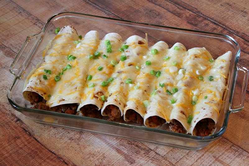 Easy Beef Burrito Casserole recipe by RecipeGirl.com #beef #burrito #casserole #recipe #RecipeGirl beef burrito casserole in a glass casserole dish