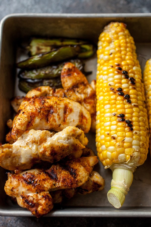 Grilled Chicken and Vegetables- corn and jalapeno set on a baking sheet