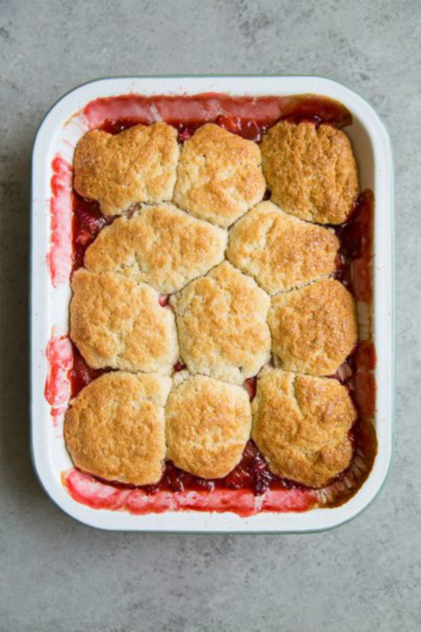 overhead shot of Strawberry Rhubarb Cobbler in a white casserole dish