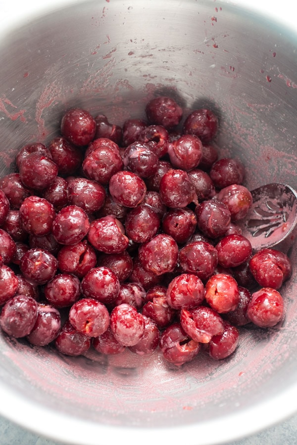 Fresh Cherry filling for Cherry Slab Pie in a metal bowl