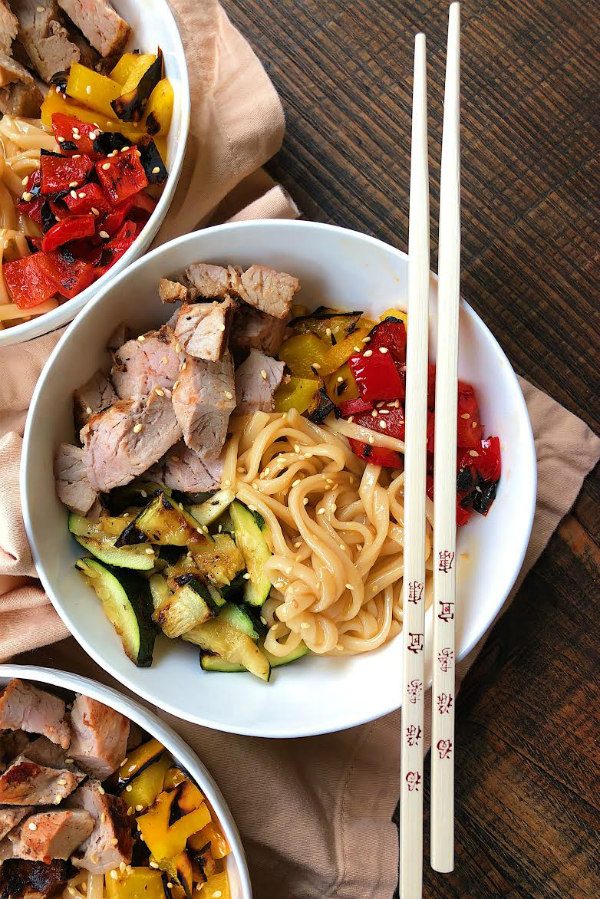 Grilled Pork and Vegetable Teriyaki Noodle Bowls in white bowls with chopsticks