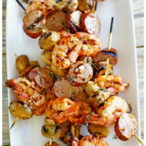 pinterest collage image for mixed grill of shrimp sausage and mushrooms