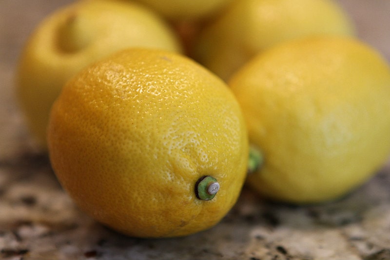 Lemons sitting on a granite countertop