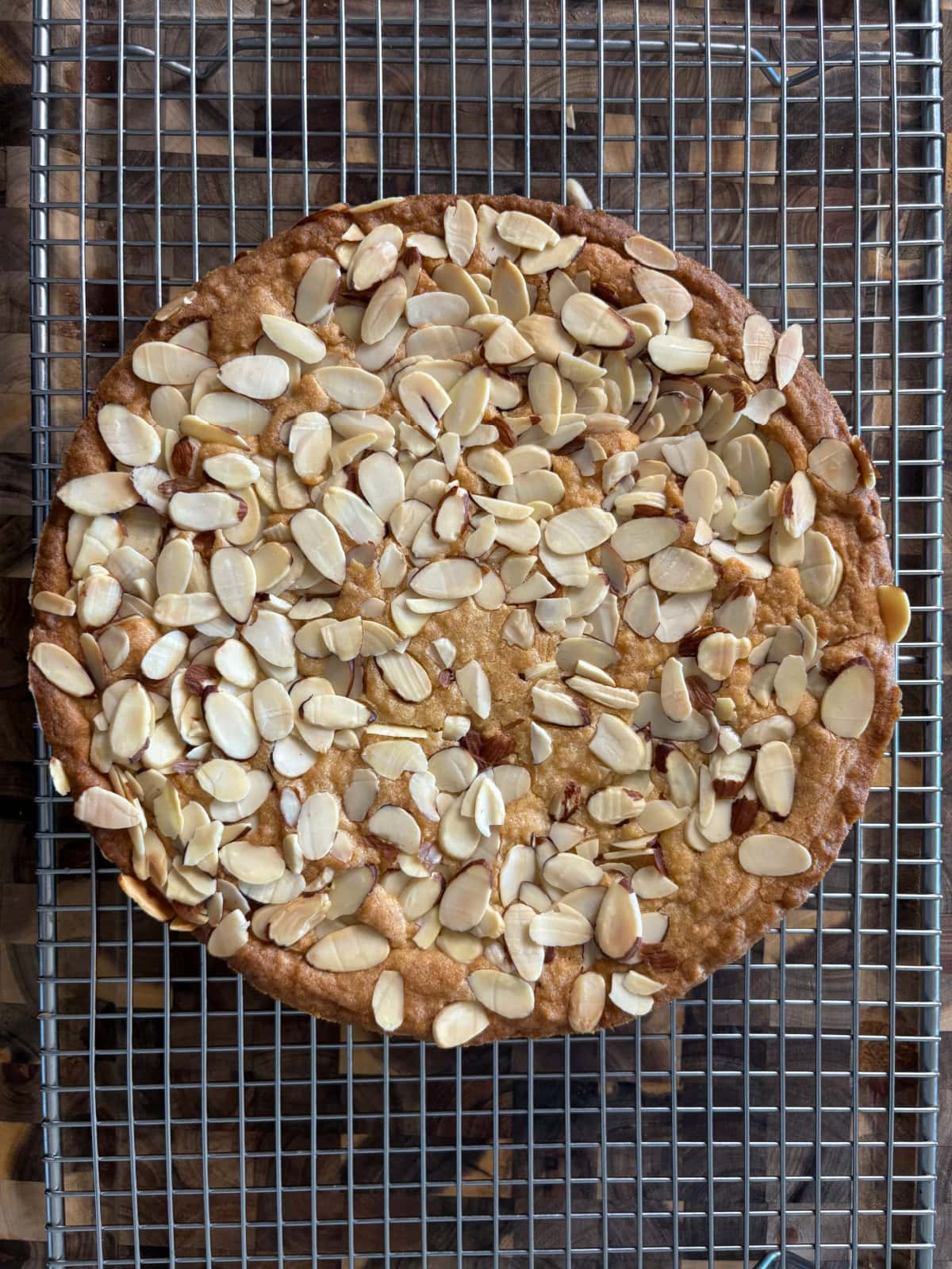 almond butter cake on cooling rack