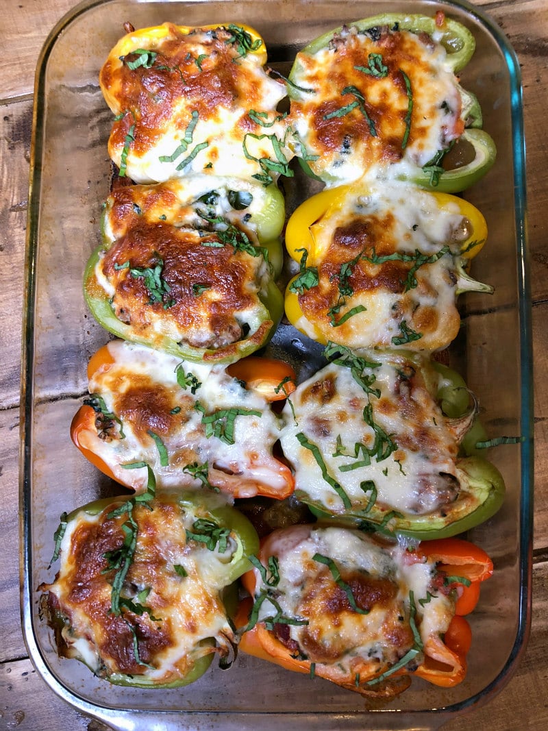 Lasagna Stuffed Peppers recipe from RecipeGirl.com #lasagna #stuffed #bell #peppers #recipe #lowcarb #keto #RecipeGirl #glutenfree Lasagna Stuffed Peppers in a baking dish