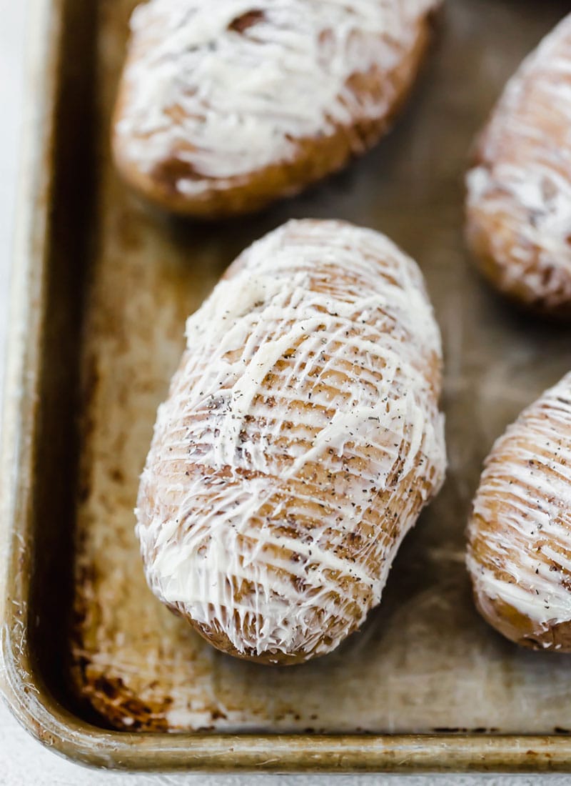 Slathering Hasselback Potatoes with butter