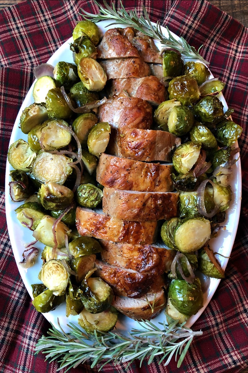 Sheet Pan Pork Tenderloin with Maple Rosemary Brussels Sprouts on a serving platter