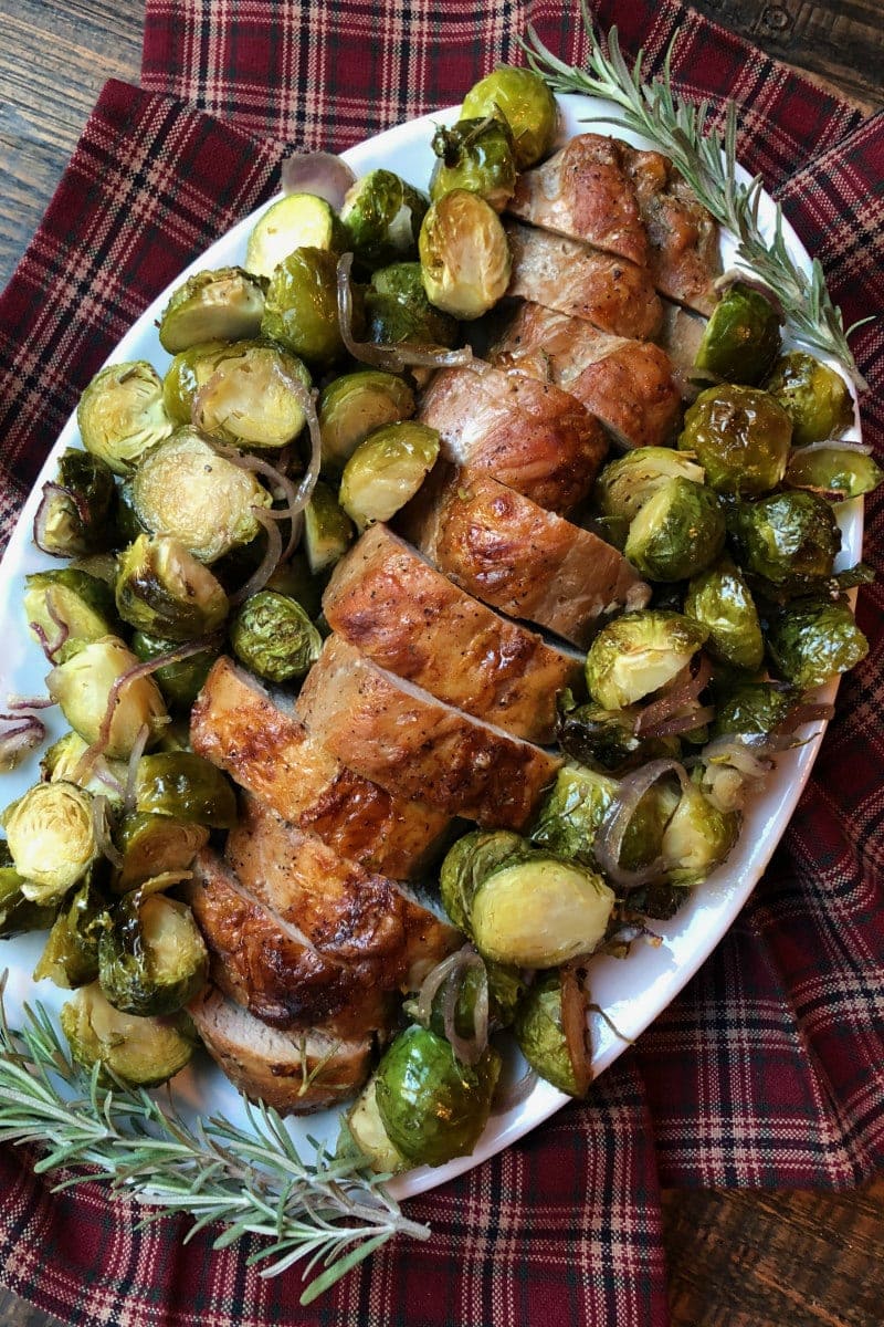 Sheet Pan Pork Tenderloin with Maple Rosemary Brussels Sprouts on a serving platter