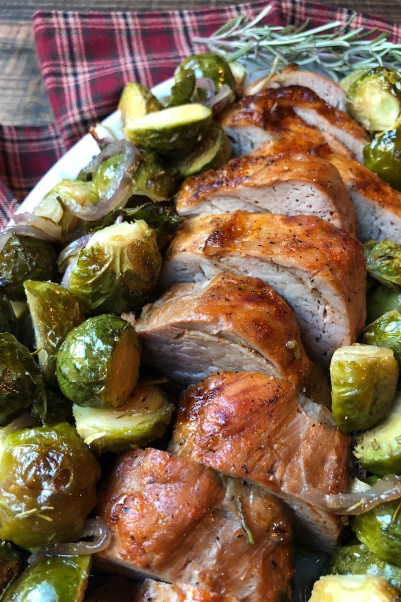 Sheet Pan Pork Tenderloin with Maple Rosemary Brussels Sprouts on a serving platter