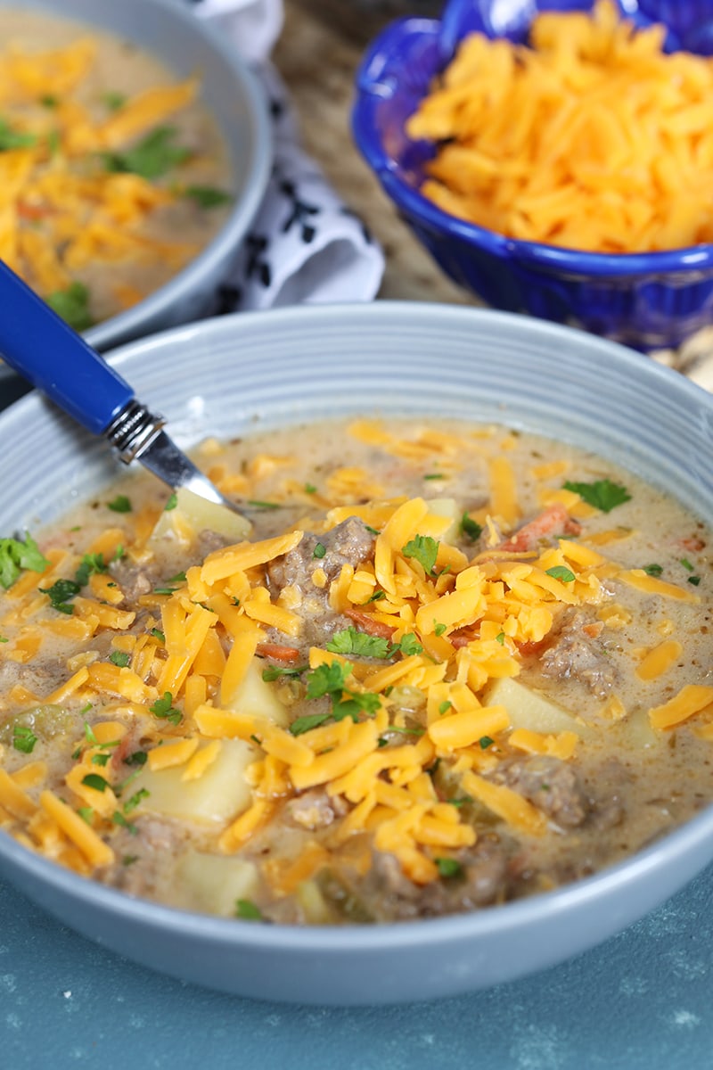 Easy Cheeseburger Soup recipe from RecipeGirl.com #easy #cheese #cheeseburger #cheddar #soup #recipe #RecipeGirl Bowl of Easy Cheeseburger Soup