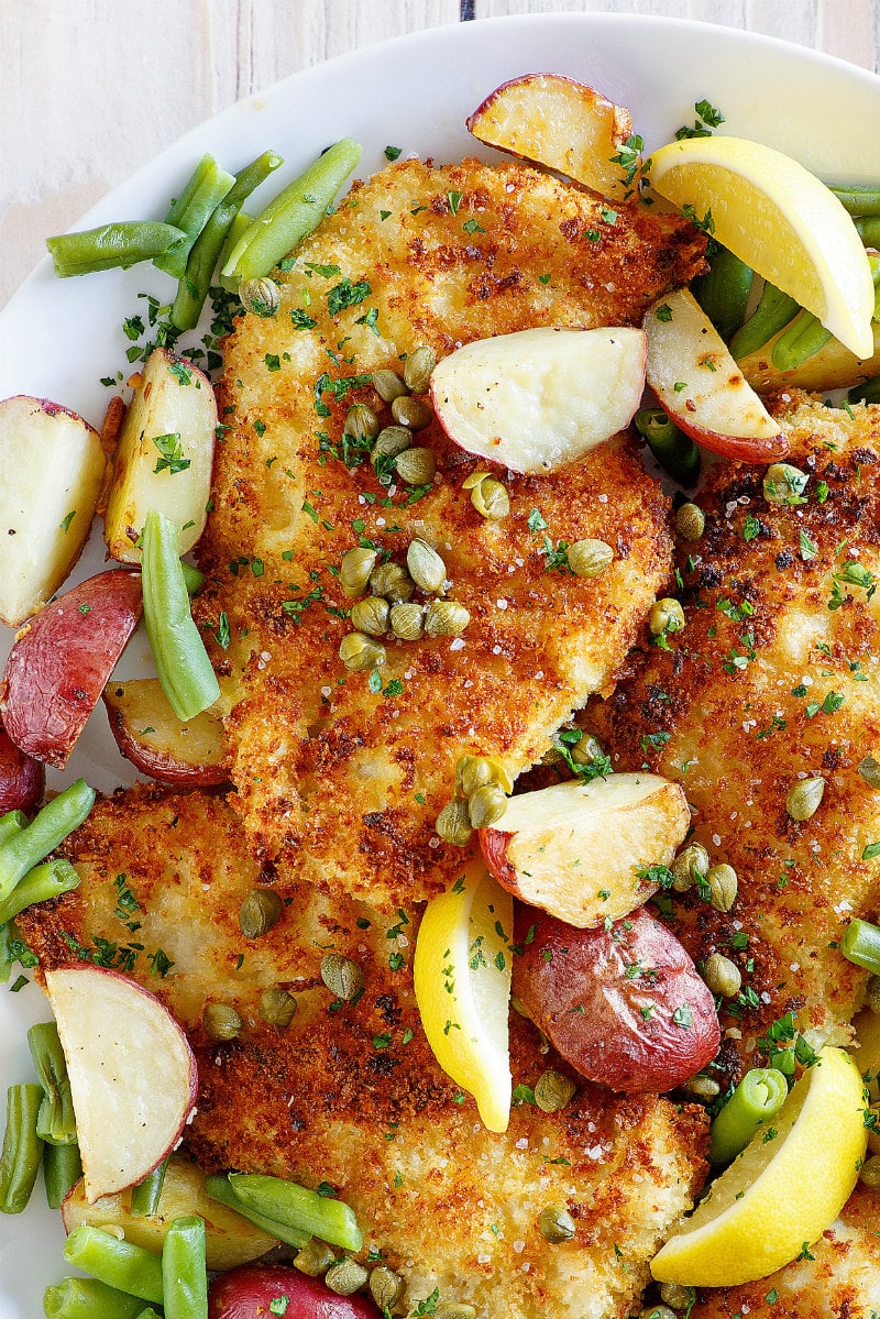 Crispy Chicken Schnitzel recipe from RecipeGirl.com #crispy #chicken #schnitzel #sheet #pan #sheetpan #dinner #recipe #RecipeGirl #weight #watchers #weightwatchers #freestyle #smartpoints #freestylesmartpoints #wwfreestyle Crispy Chicken Schnitzel up close