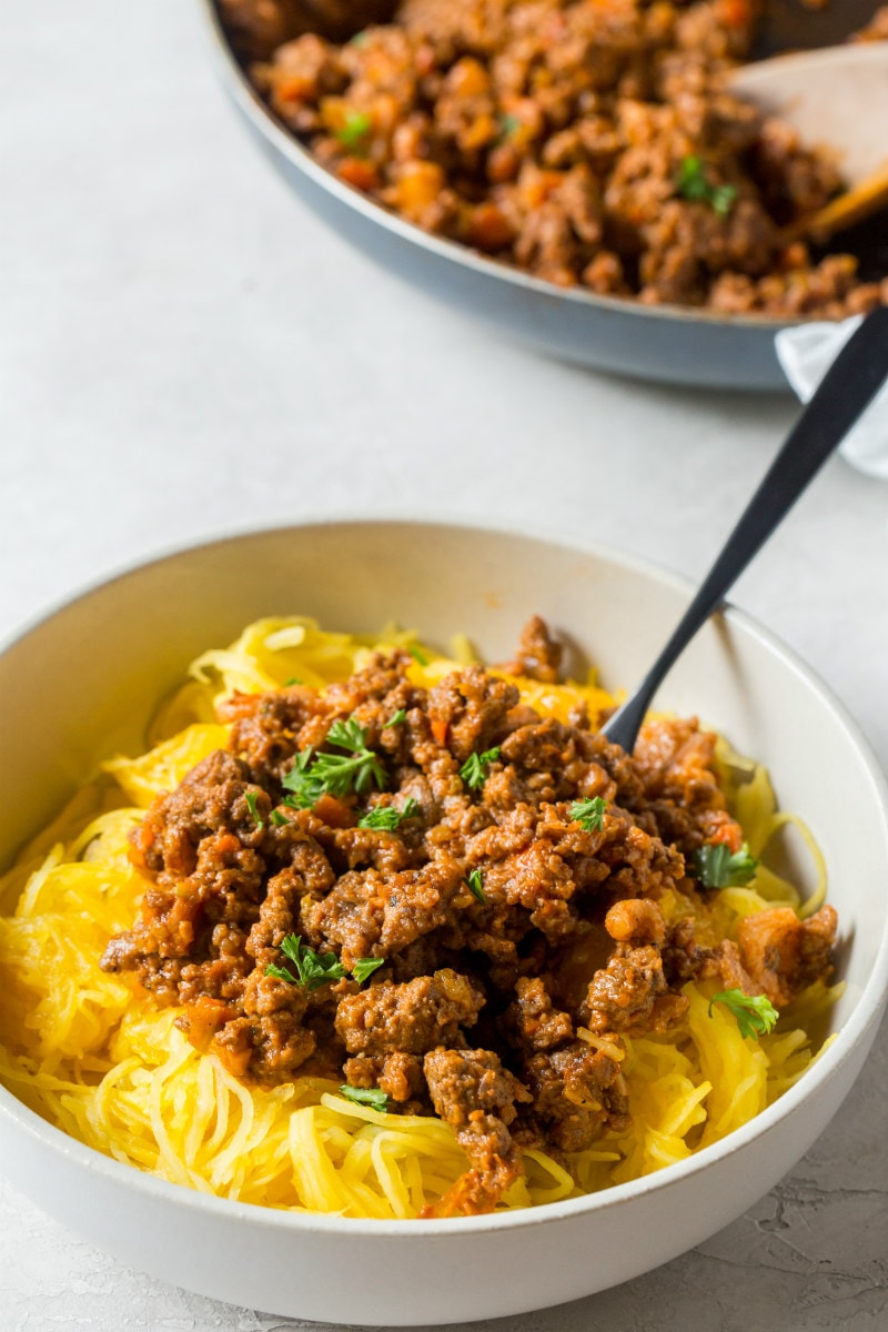 Paleo Spaghetti Squash Bolognese recipe from RecipeGirl.com #paleo #spaghetti #squash #spaghettisquash #bolognese #recipe #RecipeGirl Bowl of Spaghetti Squash Bolognese